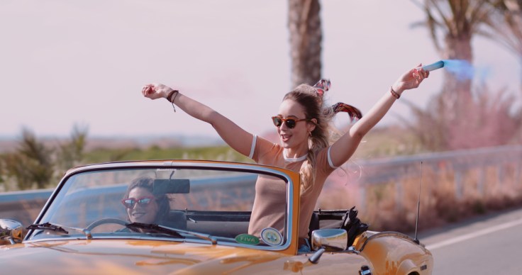 young-women-driving-convertible-car-footage-090070697_prevstill